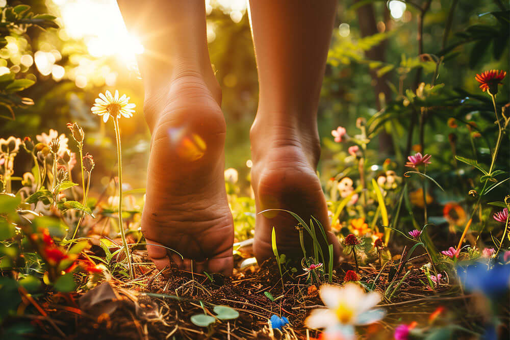 Grounding Psychology - A close-up of bare feet touching a rich textured soil