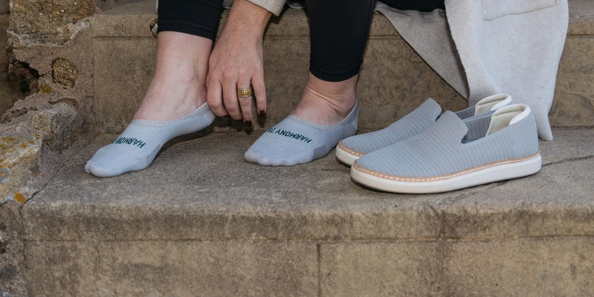 A pair of grounding socks styled with comfortable everyday footwear