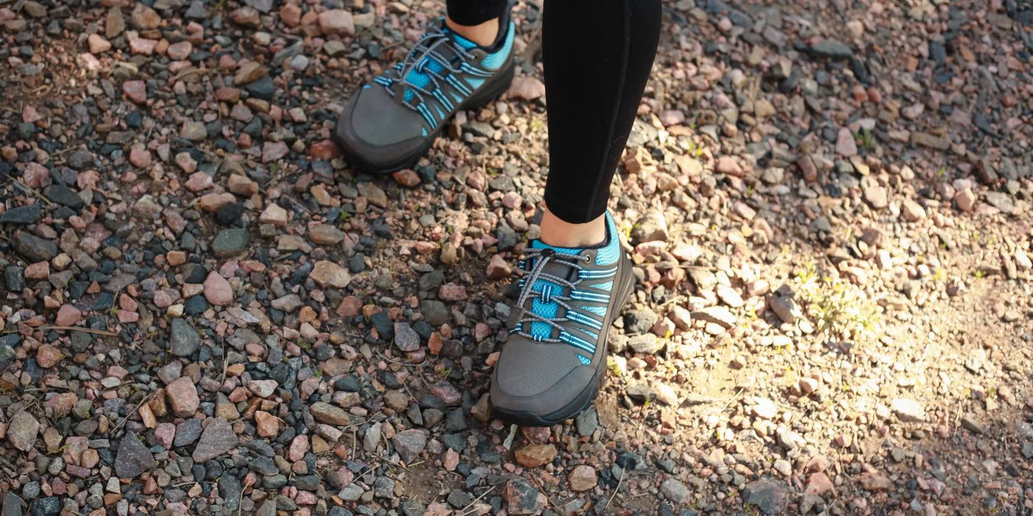 Person standing on a natural surface outdoors, connected to the earth