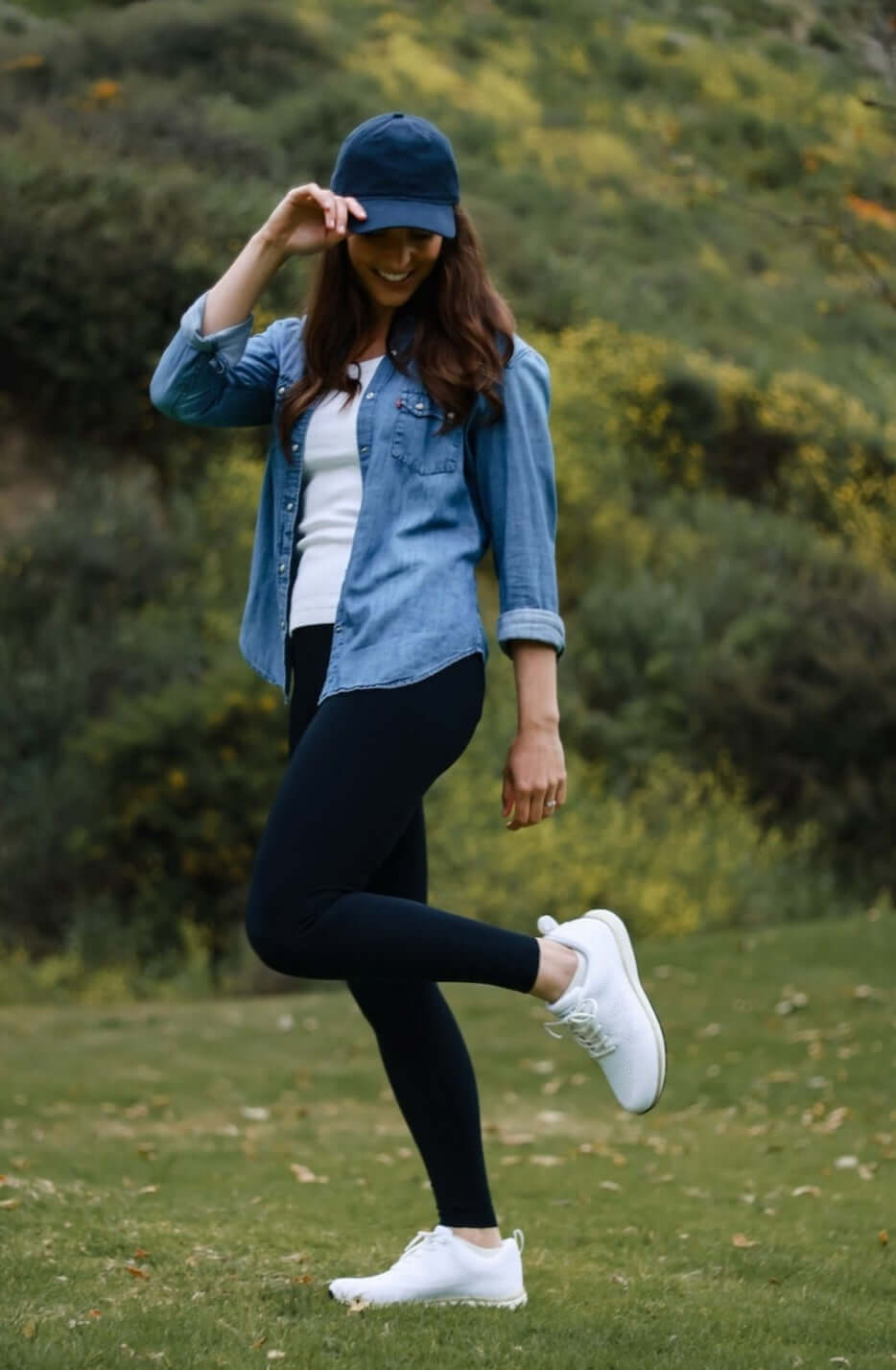Woman wearing Harmony 783 grounding white and gold knit lace-up tennis shoe in a park