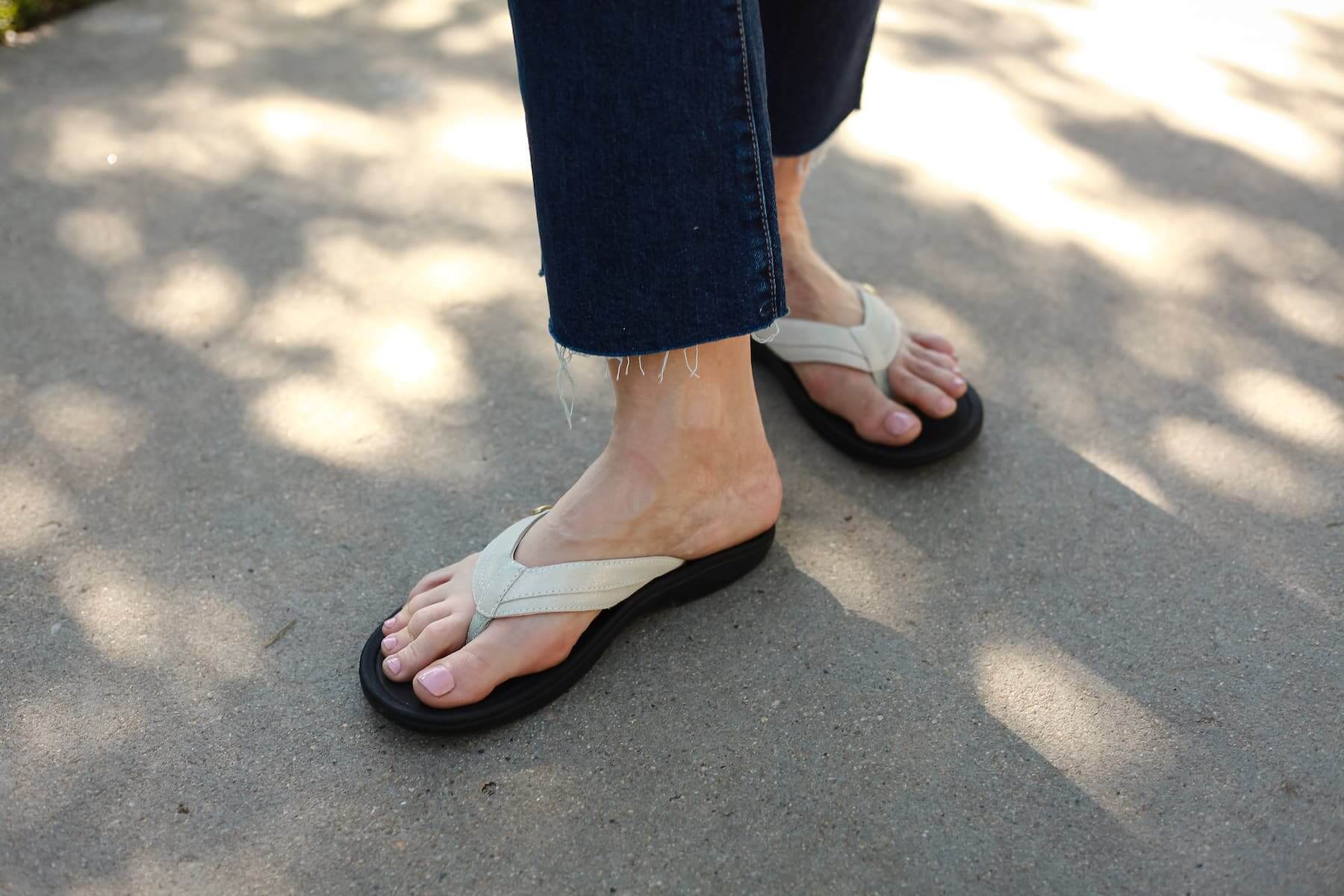 Close up of Woman in blue jeans Standing on Sidewalk wearing Harmony 783 Stella Womens Grounding Conductive Earthing Sandal in Gold Creme Shimmer Suede Flip Flop
Lifestyle2