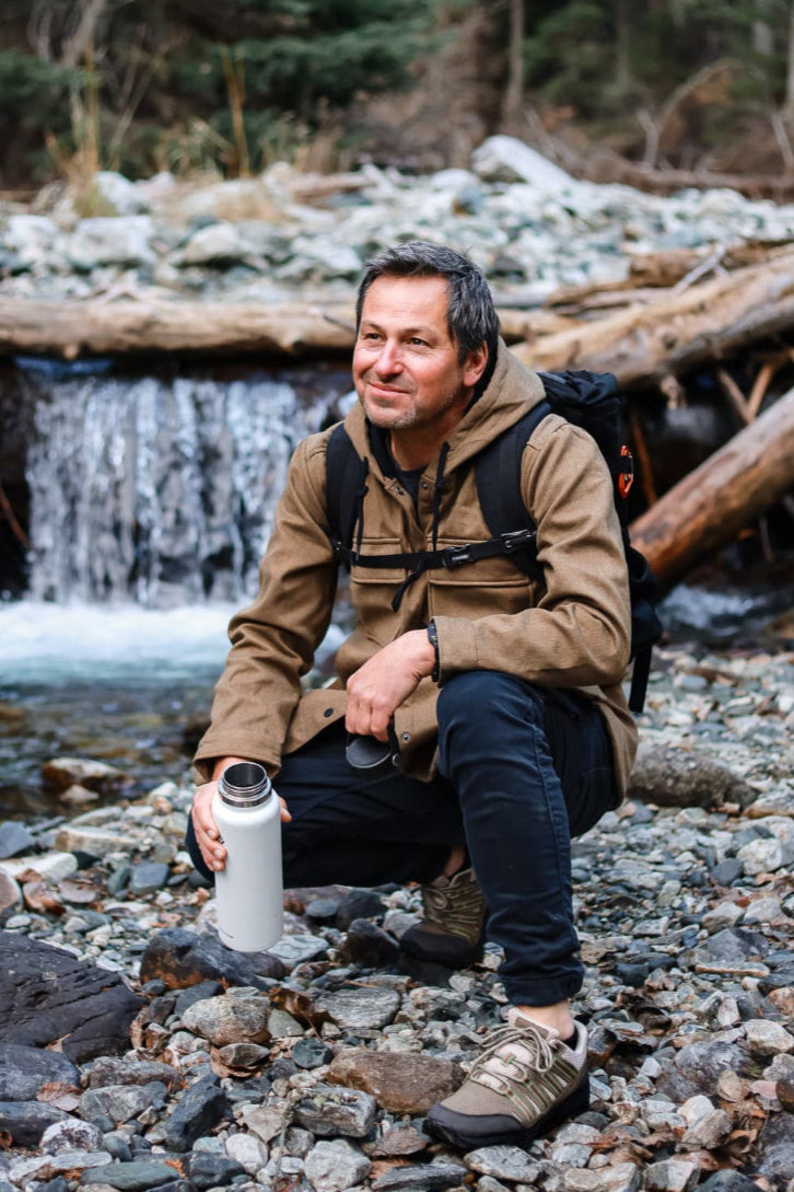 Man Grounding by River wearing Harmony 783 Trail Shoes