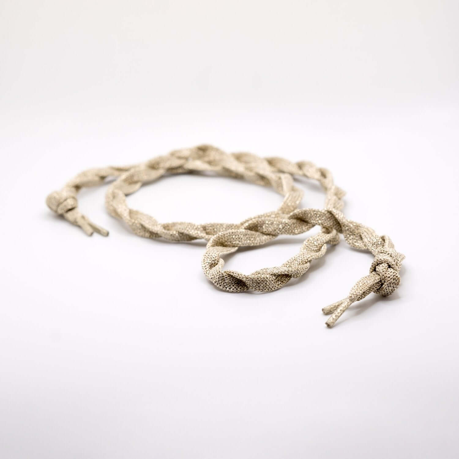 Sparkle metallic platinum flat shoelace laying down