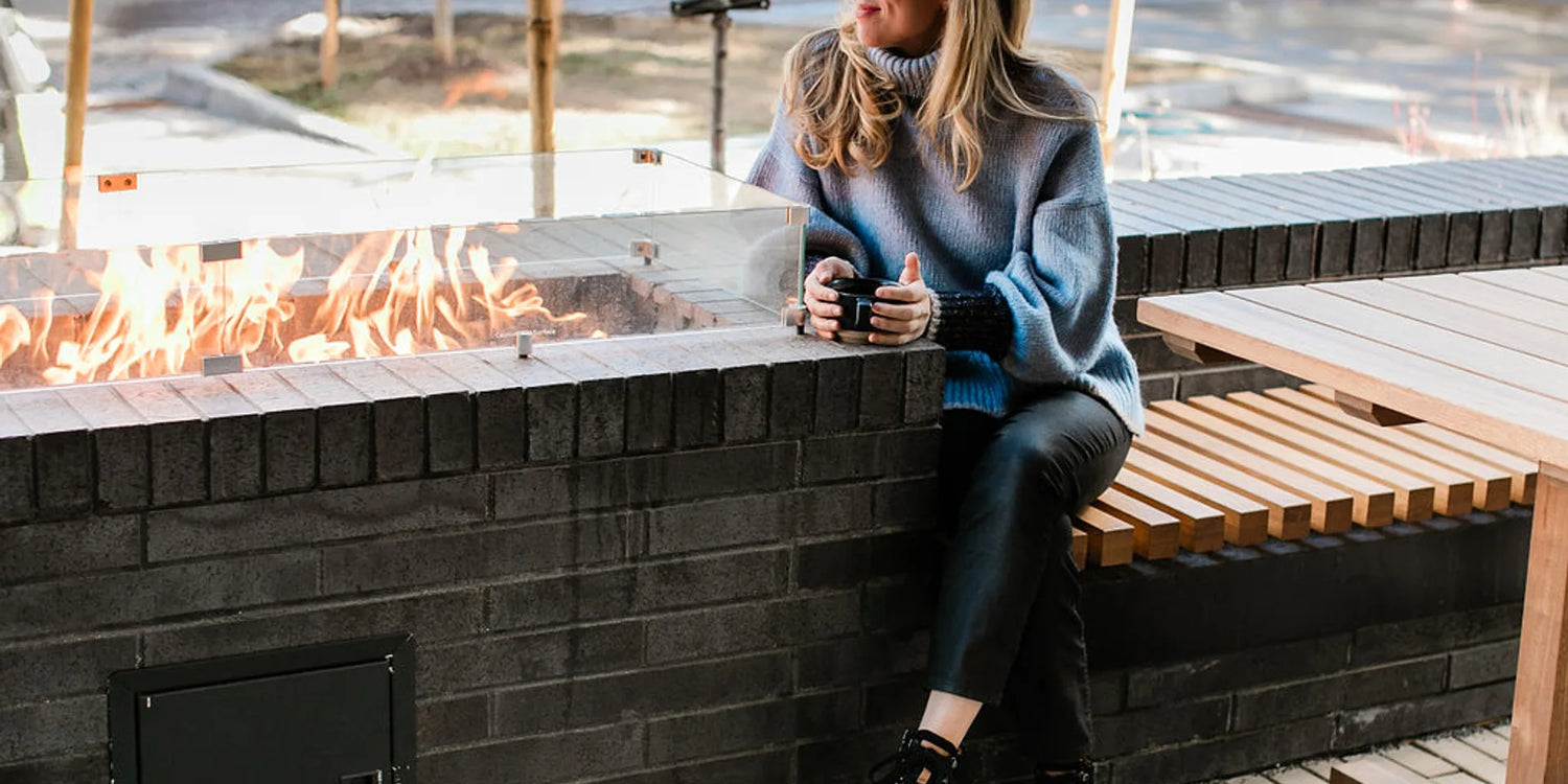 Woman wearing grounding shoes outdoors in a calm, natural setting