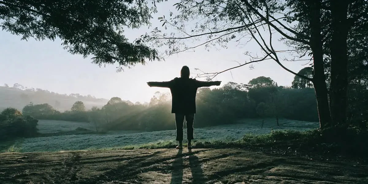 Person practicing grounding outdoors on natural earth
