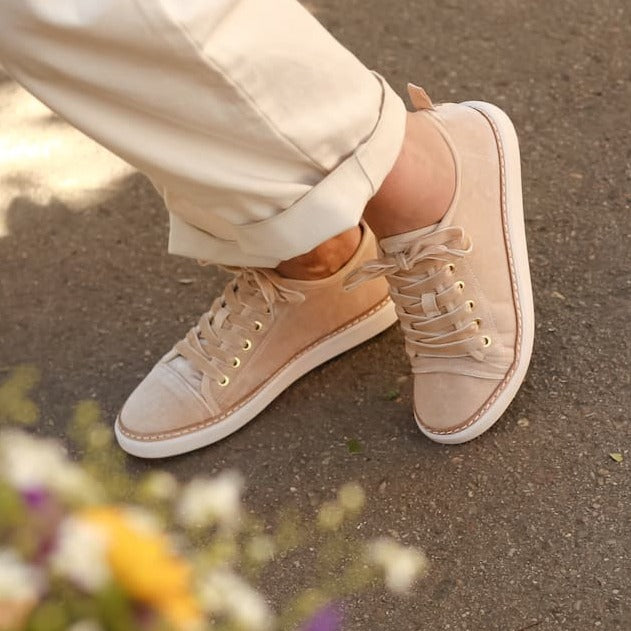 Woman wearing grounding earthing velvet walker in champagne