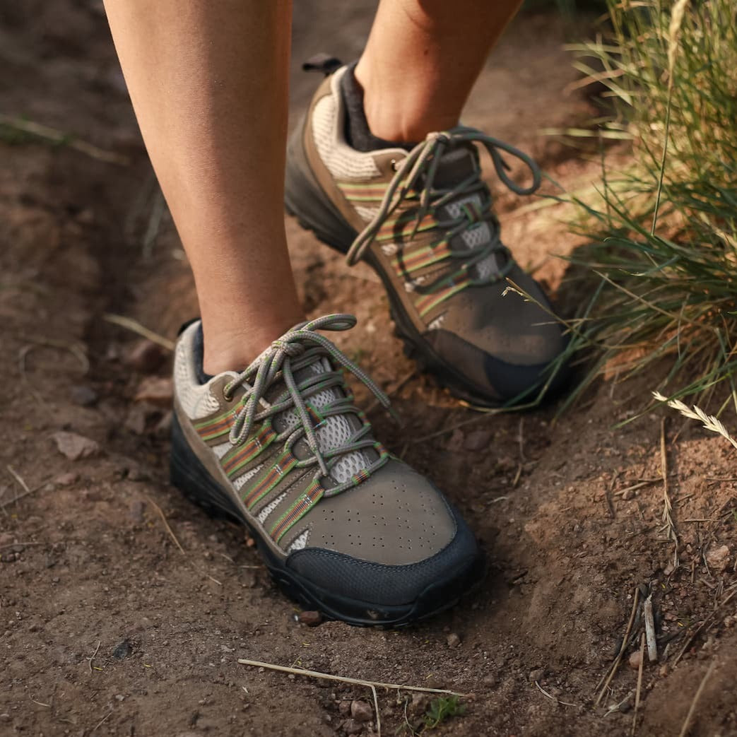 Woman hiking in Dakota Grounding Trail Shoe in Khaki and Creme