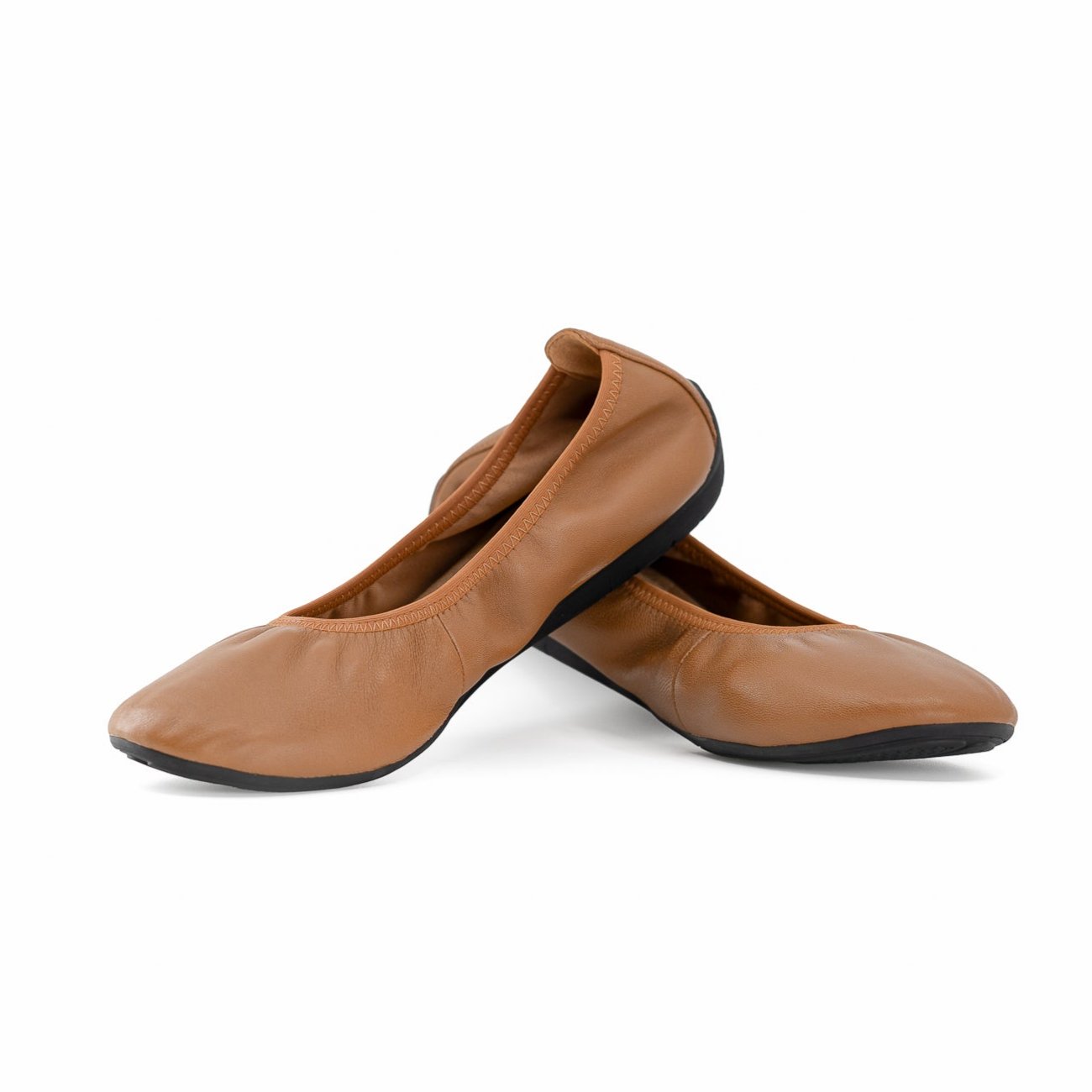 grounding cognac leather ballet flats stacked