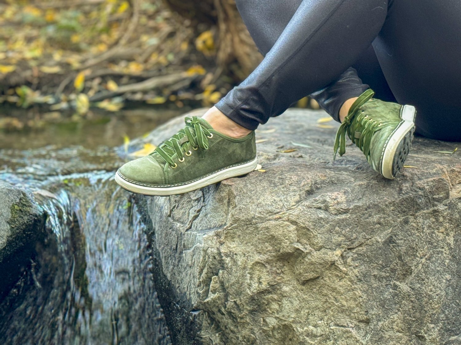 Woman wearing Harmony 783 Olive Green walkers for grounding and earthing near a river