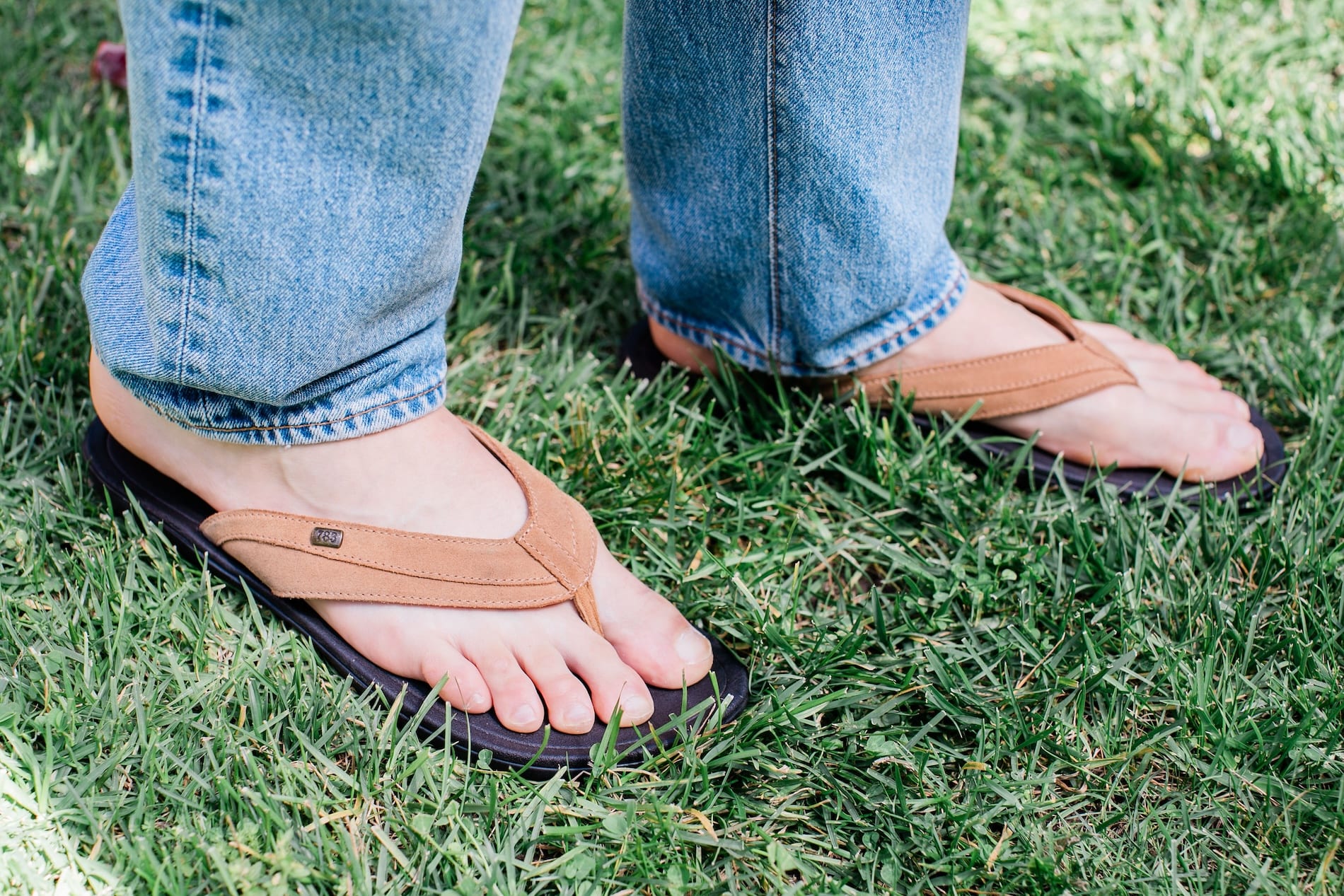 Man standing on grass wearing Harmony 783 Men’s Grounding Conductive Earthing Sandal Cameron Chestnut Nubuck Flip Flop 
lifestyle2