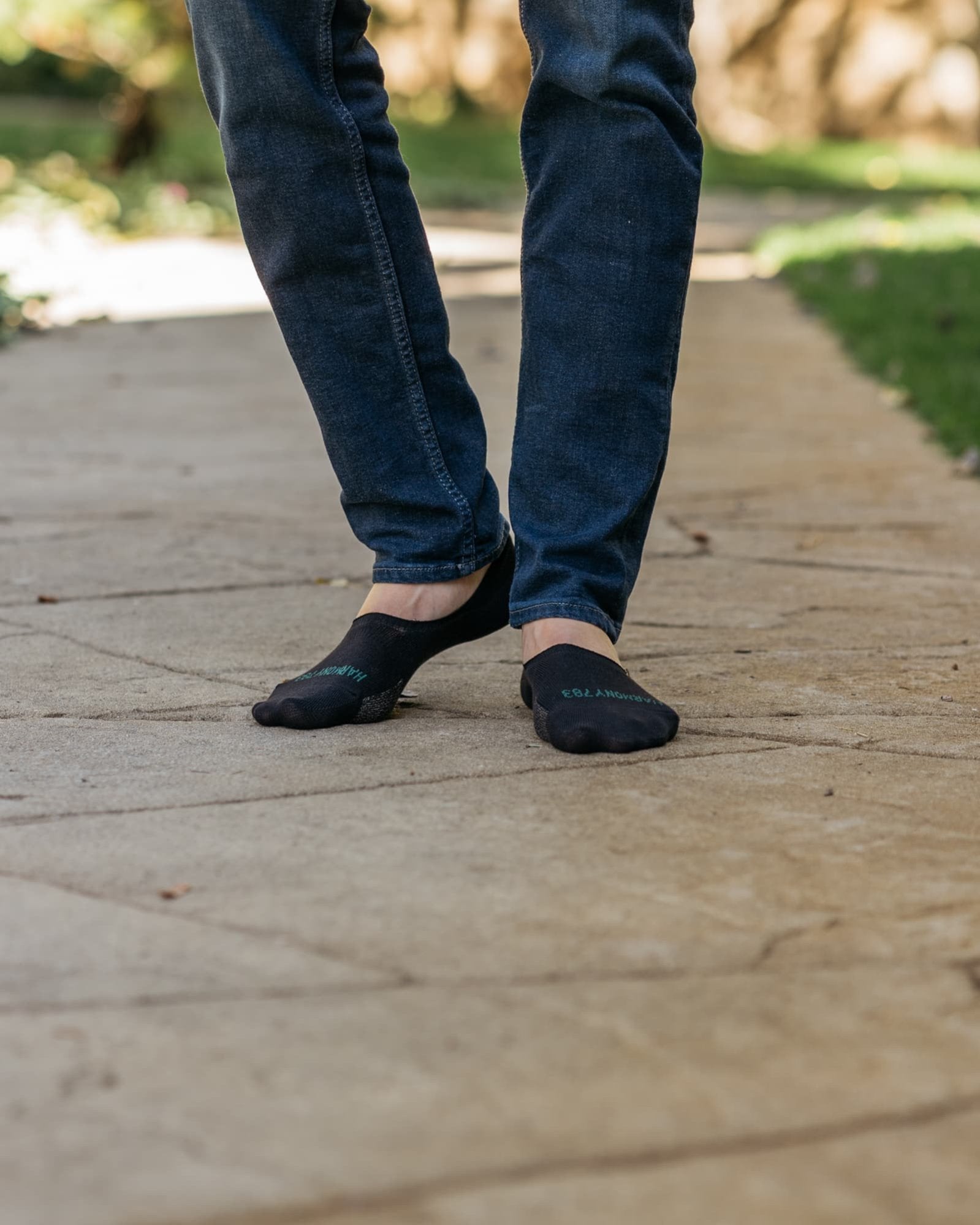 Close up of man standing on stone wearing Harmony 783 No Show black Grounding earthing socks Organic Cotton with SIlver Threads
Lifestyle 2