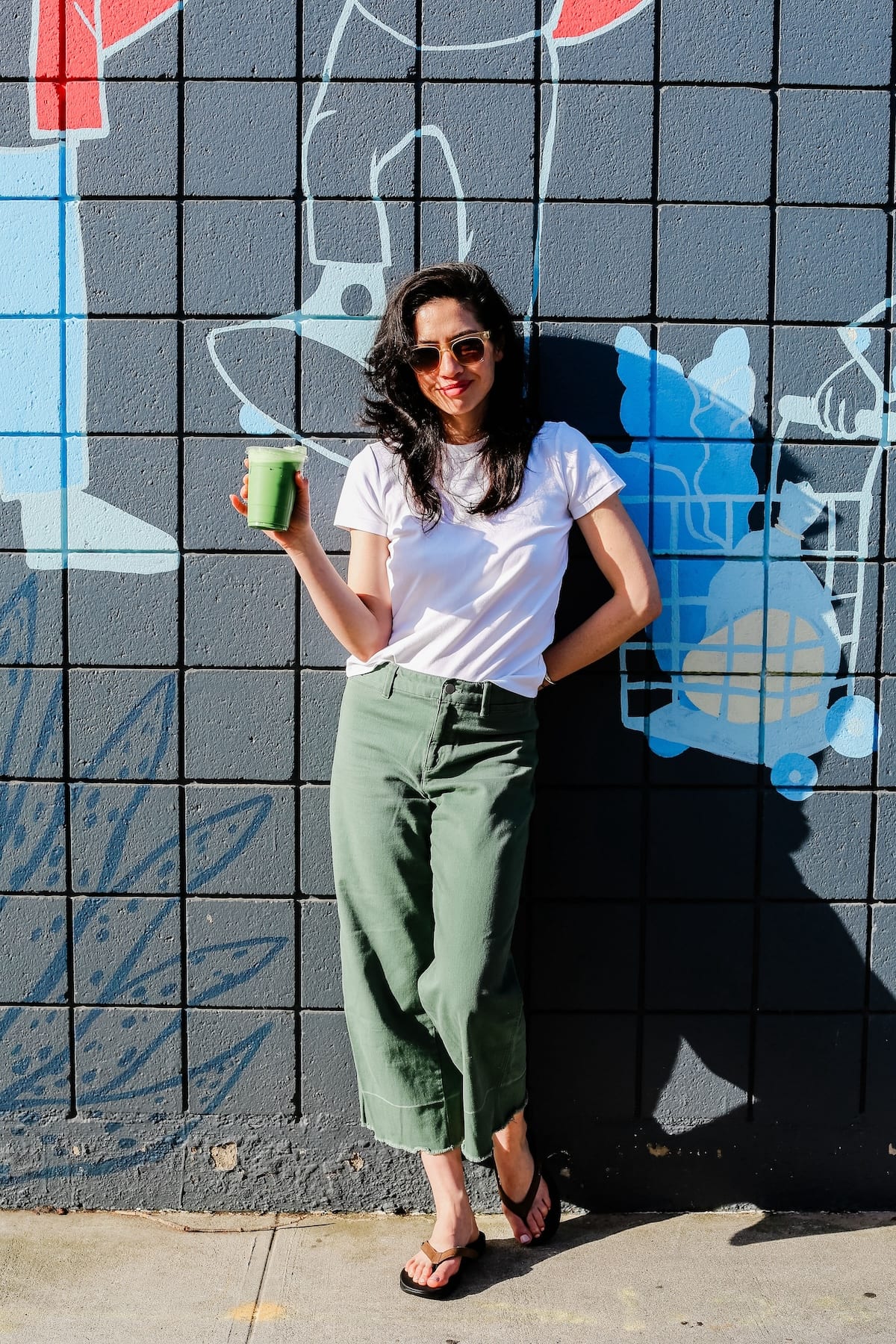 Woman in green pants Standing up against a brick wall with feet on sidewalk wearing Harmony 783 Women’s Lily Brown Leather Grounding Conductive Earthing Sandal Flip Flop
Lifestyle2