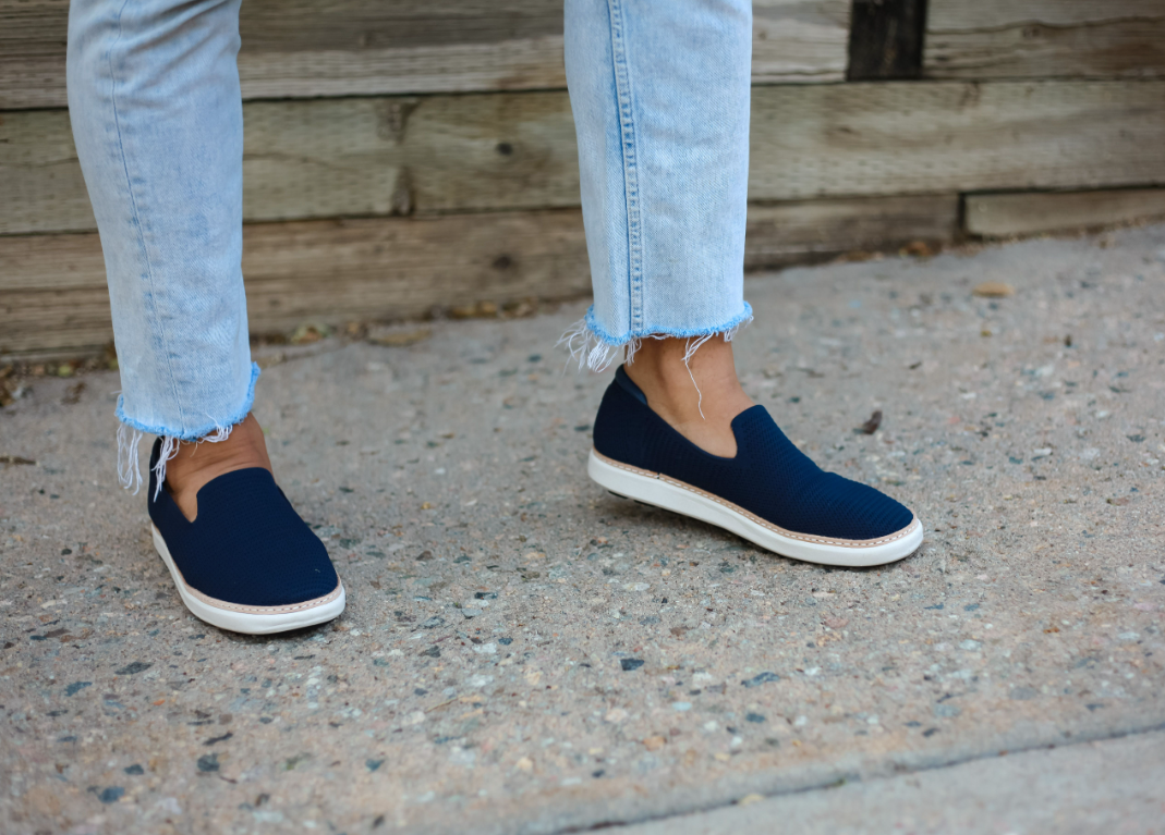 Men's wearing jeans and navy bamboo slip-on for grounding on concrete