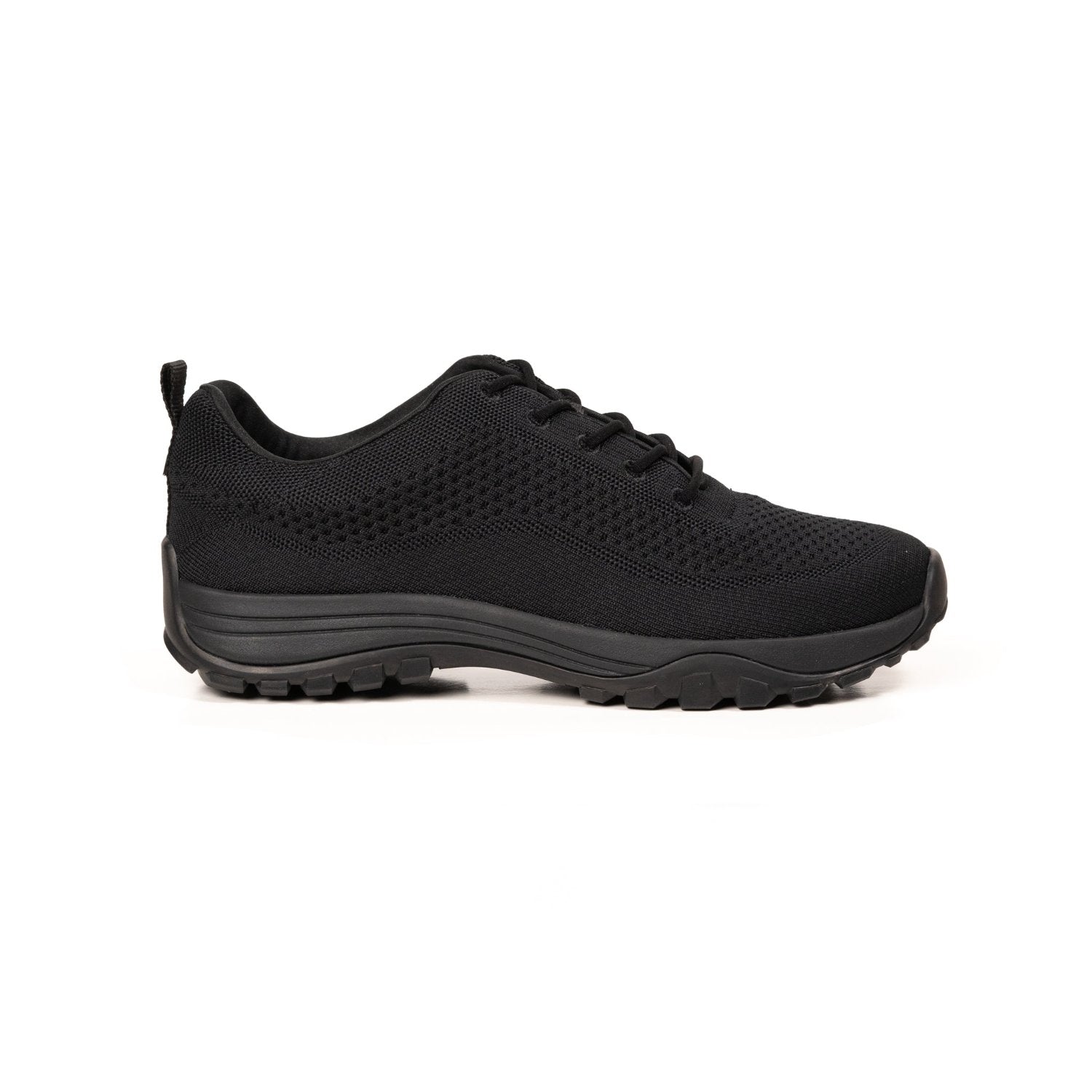 Profile view of black bamboo grounding knit sneakers