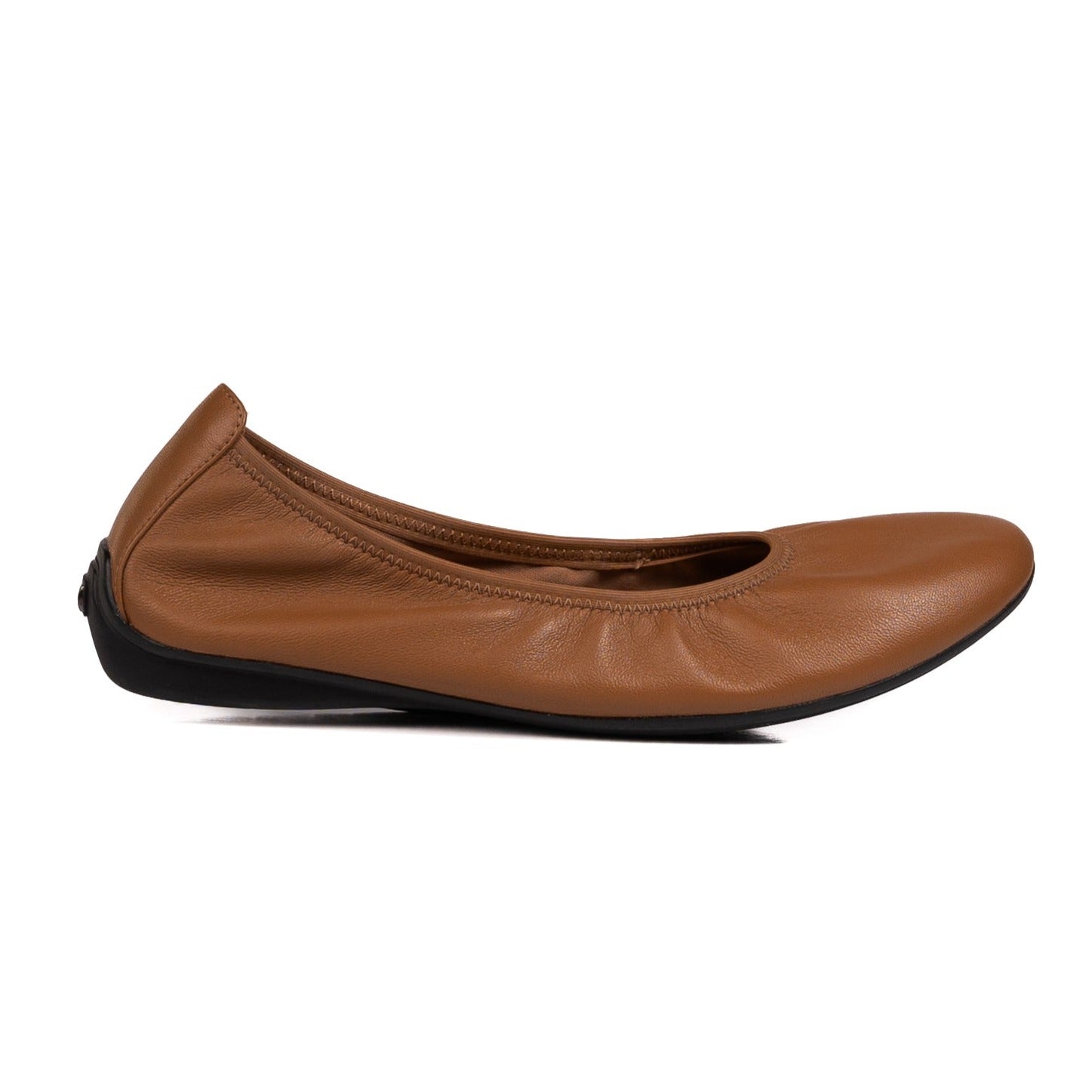 Profile side view of the cognac leather grounding ballet flat